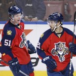 Florida Panthers defenseman Brian Campbell (51) and center Vincent Trocheck (21) celebrate Trochneck's goal and Campbells 400th career assist during the first period of an NHL hockey game, Thursday, Feb. 25, 2016 in Sunrise, Fla. (AP Photo/Wilfredo Lee)