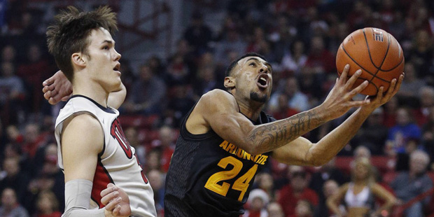 Arizona State guard Andre Spight shoots around UNLV forward Stephen Zimmerman Jr. during the first ...
