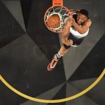 United States' Jabari Parker dunks against the World team during the second half of the NBA Rising Stars Challenge basketball game in Toronto on Friday, Feb. 12, 2016. (Mark Blinch/The Canadian Press via AP)