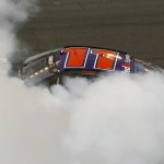 Denny Hamlin's car is enveloped in smoke as he celebrates after winning the NASCAR Daytona 500 auto race at Daytona International Speedway, Sunday, Feb. 21, 2016, in Daytona Beach, Fla. (AP Photo/Wilfredo Lee)