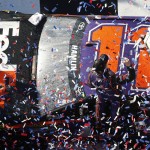 Denny Hamlin (11) celebrates in Victory Lane after winning the NASCAR Daytona 500 auto race at Daytona International Speedway, Sunday, Feb. 21, 2016, in Daytona Beach, Fla. (AP Photo/Wilfredo Lee)