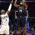 Phoenix Suns guard Ronnie Price, right, shoots as Los Angeles Clippers guard Chris Paul defends during the first half of an NBA basketball game, Monday, Feb. 22, 2016, in  Los Angeles. (AP Photo/Mark J. Terrill)