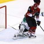 Arizona Coyotes' Martin Hanzal (11), of the Czech Republic, creates a screen as teammate Michael Stone sends the puck past Dallas Stars' Antti Niemi, left, of Finland, for a goal as Stars' Jason Demers (4) defends during the second period of an NHL hockey game Thursday, Feb. 18, 2016, in Glendale, Ariz. (AP Photo/Ross D. Franklin)