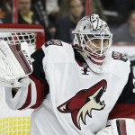 Arizona Coyotes' Louis Domingue deflects a shot during the second period of an NHL hockey game against the Philadelphia Flyers, Saturday, Feb. 27, 2016, in Philadelphia. (AP Photo/Matt Slocum)