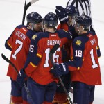 Teammates congratulate Florida Panthers center Aleksander Barkov (16) after he scored a goal during the second period of an NHL hockey game against the Arizona Coyotes, Thursday, Feb. 25, 2016 in Sunrise, Fla. (AP Photo/Wilfredo Lee)