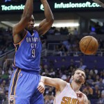 Oklahoma City Thunder's Serge Ibaka (9), of the Congo, dunks over Phoenix Suns' Mirza Teletovic (35), of Bosnia, during the first half of an NBA basketball game Monday, Feb. 8, 2016, in Phoenix. (AP Photo/Ross D. Franklin)