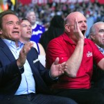 Actor Arnold Schwarzenegger, left, and Los Angeles Clippers owner Steve Ballmer cheer during the first half of an NBA basketball game between the Clippers and the Phoenix Suns, Monday, Feb. 22, 2016, in  Los Angeles. (AP Photo/Mark J. Terrill)