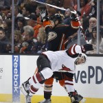 Anaheim Ducks defenseman Kevin Bieksa, top, gets a roughing penalty after a hit on Arizona Coyotes' Tobias Rieder during the second period of an NHL hockey game in Anaheim, Calif., Friday, Feb. 5, 2016. (AP Photo/Christine Cotter)