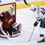 Los Angeles Kings' Vincent Lecavalier (44) flips the puck over Arizona Coyotes' Anders Lindback (29), of Sweden, for a goal during the third period of an NHL hockey game Tuesday, Feb. 2, 2016, in Glendale, Ariz.  The Kings defeated the Coyotes 6-2. (AP Photo/Ross D. Franklin)