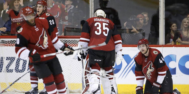 Arizona Coyotes' Kevin Connauton (44), Louis Domingue (35), Michael Stone (26) and Anthony Duclair,...