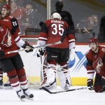 Arizona Coyotes' Kevin Connauton (44), Louis Domingue (35), Michael Stone (26) and Anthony Duclair, left, react after a goal is scored by Chicago Blackhawks' Patrick Kane during the second period of an NHL hockey game Thursday, Feb. 4, 2016, in Glendale, Ariz. (AP Photo/Ross D. Franklin)