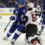 Tampa Bay Lightning's Nikita Nesterov, of Russia, collides with Arizona Coyotes' Antoine Vermette during the first period of an NHL hockey game Tuesday, Feb. 23, 2016, in Tampa, Fla. (AP Photo/Mike Carlson)