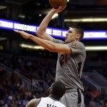 Phoenix Suns center Alex Len (21) shoots over Brooklyn Nets forward Willie Reed during the fourth quarter of an NBA basketball game Thursday, Feb. 25, 2016, in Phoenix. The Nets defeated the Suns 116-106. (AP Photo/Rick Scuteri)