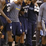 Memphis Grizzlies forward Brandan Wright (34) is helped off the court by teammates during the third quarter of the team's NBA basketball game against the Phoenix Suns, Saturday, Feb. 27, 2016, in Phoenix. The Suns defeated the Grizzlies 111-106. (AP Photo/Rick Scuteri)
