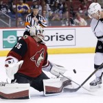 Arizona Coyotes' Louis Domingue (35) makes a save on a shot by Los Angeles Kings' Jeff Carter (77) during the first period of an NHL hockey game Tuesday, Feb. 2, 2016, in Glendale, Ariz. (AP Photo/Ross D. Franklin)