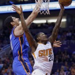 Phoenix Suns' Archie Goodwin (20) loses the ball in front of Oklahoma City Thunder's Enes Kanter, left, during the second half of an NBA basketball game Monday, Feb. 8, 2016, in Phoenix. The Thunder defeated the Suns 122-106. (AP Photo/Ross D. Franklin)