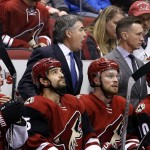 Arizona Coyotes' Dave Tippett, top middle, argues with officials in his 1,000th game as a head coach, during the first period of an NHL hockey game against the Los Angeles Kings Tuesday, Feb. 2, 2016, in Glendale, Ariz. (AP Photo/Ross D. Franklin)
