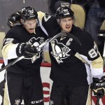 Pittsburgh Penguins' Patric Hornqvist (72) celebrates his second goal of the first period with teammate Sidney Crosby (87) during an NHL hockey game against the Arizona Coyotes in Pittsburgh, Monday, Feb. 29, 2016. (AP Photo/Gene J. Puskar)