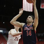 Arizona's Dusan Ristic (14) shoots in front of Washington State's Josh Hawkinson (24) during the first half of an NCAA college basketball game, Wednesday, Feb. 3, 2016, in Pullman, Wash. (AP Photo/Young Kwak)