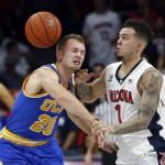 UCLA guard Bryce Alford (20) and Arizona guard Gabe York vie for a oose ball during the second half of an NCAA college basketball game Friday, Feb 12, 2016, in Tucson, Ariz. Arizona defeated UCLA 81-75. (AP Photo/Rick Scuteri)