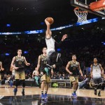United States' Zach LaVine dunks in front of World players during the second half of the NBA Rising Stars Challenge basketball game in Toronto on Friday, Feb. 12, 2016. (Mark Blinch/The Canadian Press via AP)