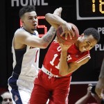 Utah guard Brandon Taylor (11) and Arizona guard Gabe York (1)fight for the ball during the second half of an NCAA college basketball game in Salt Lake City, Saturday, Feb. 27, 2016. Utah defeated Arizona 70-64. (AP Photo/George Frey)