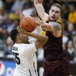 Colorado guard Dominique Collier, left, has his shot blocked by Arizona State forward Eric Jacobsen in the second half of an NCAA college basketball game Sunday, Feb. 28, 2016, in Boulder, Colo. Colorado won 79-69. (AP Photo/David Zalubowski)