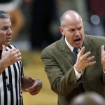 Colorado head coach Tad Boyle, right, argues a call with a referee while facing Arizona State in the second half of an NCAA college basketball game, Sunday, Feb. 28, 2016, in Boulder, Colo. Colorado won 79-69. (AP Photo/David Zalubowski)