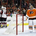 Arizona Coyotes' Shane Doan (19) and Kevin Connauton (44) celebrate after a goal by teammate Brad Richardson past Philadelphia Flyers' Michal Neuvirth (30) during the first period of an NHL hockey game, Saturday, Feb. 27, 2016, in Philadelphia. (AP Photo/Matt Slocum)