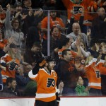 Philadelphia Flyers' Claude Giroux reacts after scoring a goal for his 500th career point during the first period of an NHL hockey game against the Arizona Coyotes, Saturday, Feb. 27, 2016, in Philadelphia. Philadelphia won 4-2. (AP Photo/Matt Slocum)
