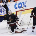 St. Louis Blues' David Backes (42) celebrates a goal by teammate Alexander Steen against Arizona Coyotes goalie Louis Domingue (35) as Coyotes' Klas Dahlbeck (34), of Sweden, skates past during the first period of an NHL hockey game Saturday, Feb. 20, 2016, in Glendale, Ariz. (AP Photo/Ross D. Franklin)