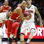 Utah guard Brandon Taylor (11) drivers to the basket past Arizona guard Gabe York (1) during the first half of an NCAA college basketball game in Salt Lake City, Saturday, Feb. 27, 2016. (AP Photo/George Frey)