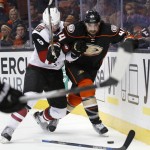 Anaheim Ducks' Nate Thompson, right, and Arizona Coyotes' Connor Murphy vie for the puck during the second period of an NHL hockey game in Anaheim, Calif., Friday, Feb. 5, 2016. (AP Photo/Christine Cotter)