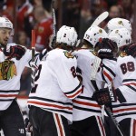 Chicago Blackhawks' Patrick Kane (88) celebrates his goal against the Arizona Coyotes with Duncan Keith (2), Artem Anisimov (15), of Russia, Artemi Panarin (72), of Russia, and Niklas Hjalmarsson during the second period of an NHL hockey game Thursday, Feb. 4, 2016, in Glendale, Ariz. (AP Photo/Ross D. Franklin)