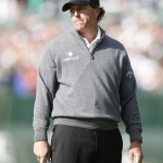 Phil Mickelson reacts after missing a birdie putt on the 16th hole during the first round of the Phoenix Open golf tournament, Thursday, Feb. 4, 2016, in Scottsdale, Ariz. (AP Photo/Rick Scuteri)