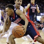 Arizona's Parker Jackson-Cartwright (0) tries to get by Washington's Matisse Thybulle after catching an inbounds pass late the second half of an NCAA college basketball game Saturday, Feb. 6, 2016, in Seattle. Arizona won 77-72. (AP Photo/Elaine Thompson)