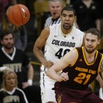 Arizona State forward Eric Jacobsen, front, loses control of the ball as Colorado forward Josh Scott defends in the second half of an NCAA college basketball game, Sunday, Feb. 28, 2016, in Boulder, Colo. Colorado won 79-69. (AP Photo/David Zalubowski)