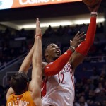 Houston Rockets center Dwight Howard (12) drives past Phoenix Suns forward Mirza Teletovic in the first quarter during an NBA basketball game, Friday, Feb. 19, 2016, in Phoenix. (AP Photo/Rick Scuteri)