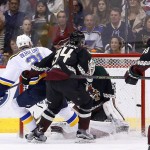 St. Louis Blues' Patrik Berglund (21), of Sweden, scores a goal against Arizona Coyotes goalie Louis Domingue, second from right, as Coyotes' Klas Dahlbeck (34), of Sweden, and Jordan Martinook (48) watch during the third period of an NHL hockey game Saturday, Feb. 20, 2016, in Glendale, Ariz. The Blues defeated the Coyotes 6-4. (AP Photo/Ross D. Franklin)