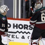 After giving up four goals to the St. Louis Blues, Arizona Coyotes' Louis Domingue (35) is replaced by Niklas Treutle (60), of Germany, during the first period of an NHL hockey game Saturday, Feb. 20, 2016, in Glendale, Ariz. (AP Photo/Ross D. Franklin)