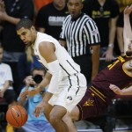 Colorado forward Josh Scott, left, knocks over Arizona State forward Eric Jacobsen while picking up the ball in the first half of an NCAA college basketball game Sunday, Feb. 28, 2016, in Boulder, Colo. (AP Photo/David Zalubowski)