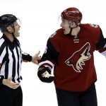 Arizona Coyotes' Michael Stone, right, argues a penalty with referee Gord Dwyer (19) during the third period of an NHL hockey game against the Los Angeles Kings Tuesday, Feb. 2, 2016, in Glendale, Ariz. The Kings defeated the Coyotes 6-2. (AP Photo/Ross D. Franklin)