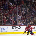 Fans cheer as Washington Capitals left wing Alex Ovechkin celebrates his goal against the Arizona Coyotes during the third period of an NHL hockey game, on Monday, Feb. 22, 2016, in Washington. The Capitals defeated the Coyotes 3-2. (AP Photo/Evan Vucci)
