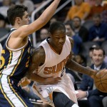 Phoenix Suns guard Archie Goodwin, right, drives on Utah Jazz guard Raul Neto during the third quarter of an NBA basketball game Saturday, Feb. 6, 2016, in Phoenix. The Jazz defeated the Suns 98-89. (AP Photo/Rick Scuteri)