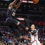 Phoenix Suns guard Archie Goodwin, left, dunks as Los Angeles Clippers guard Pablo Prigioni, of Argentina, defends during the first half of an NBA basketball game, Monday, Feb. 22, 2016, in  Los Angeles. (AP Photo/Mark J. Terrill)