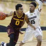Arizona State guard Tra Holder, left, drives the lane for a basket as Colorado guard Dominique Collier defends in the first half of an NCAA college basketball game Sunday, Feb. 28, 2016, in Boulder, Colo. (AP Photo/David Zalubowski)