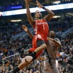 Houston Rockets forward Trevor Ariza (1) is fouled by Phoenix Suns guard Archie Goodwin during the second quarter of an NBA basketball game Thursday, Feb. 4, 2016, in Phoenix. (AP Photo/Rick Scuteri)
