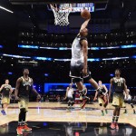 U.S. forward Jabari Parker dunks during the first half of the NBA Rising Stars Challenge basketball game in Toronto on Friday, Feb. 12, 2016. (Warren Toda/Pool Photo via AP)