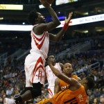 Houston Rockets guard Patrick Beverley draws the blocking foul on Phoenix Suns guard Ronnie Price (14) in the second quarter during an NBA basketball game, Friday, Feb. 19, 2016, in Phoenix. (AP Photo/Rick Scuteri)