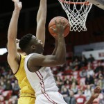 Washington State's Ike Iroegbu, right, shoots against Arizona State's Eric Jacobsen during the first half of an NCAA college basketball game, Saturday, Feb. 6, 2016, in Pullman, Wash. (AP Photo/Young Kwak)
